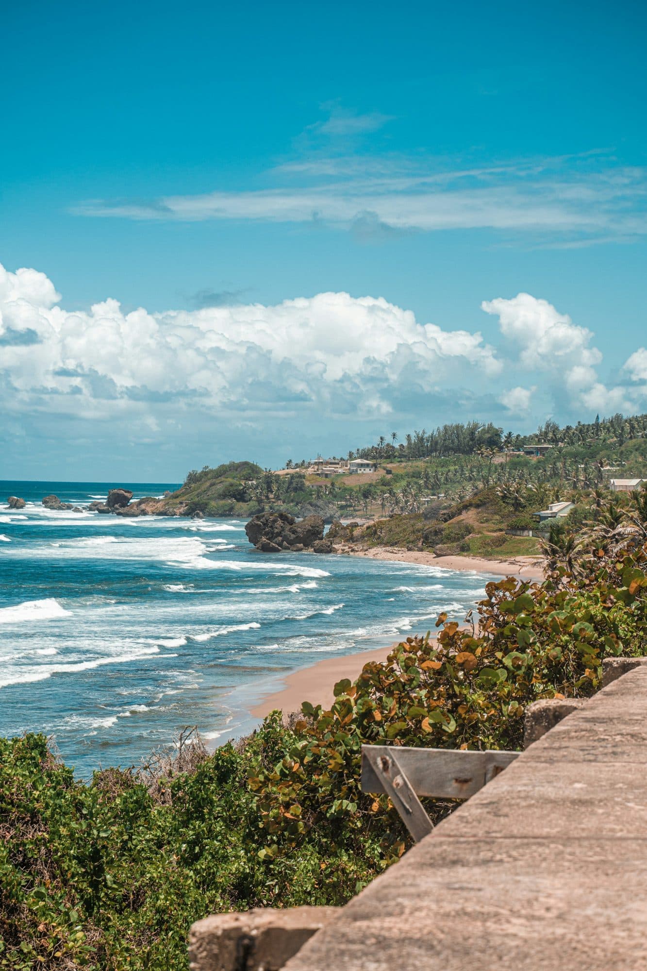 Atlantic surf and rock formations on the east coast of Barbados, in the style of Bathsheba